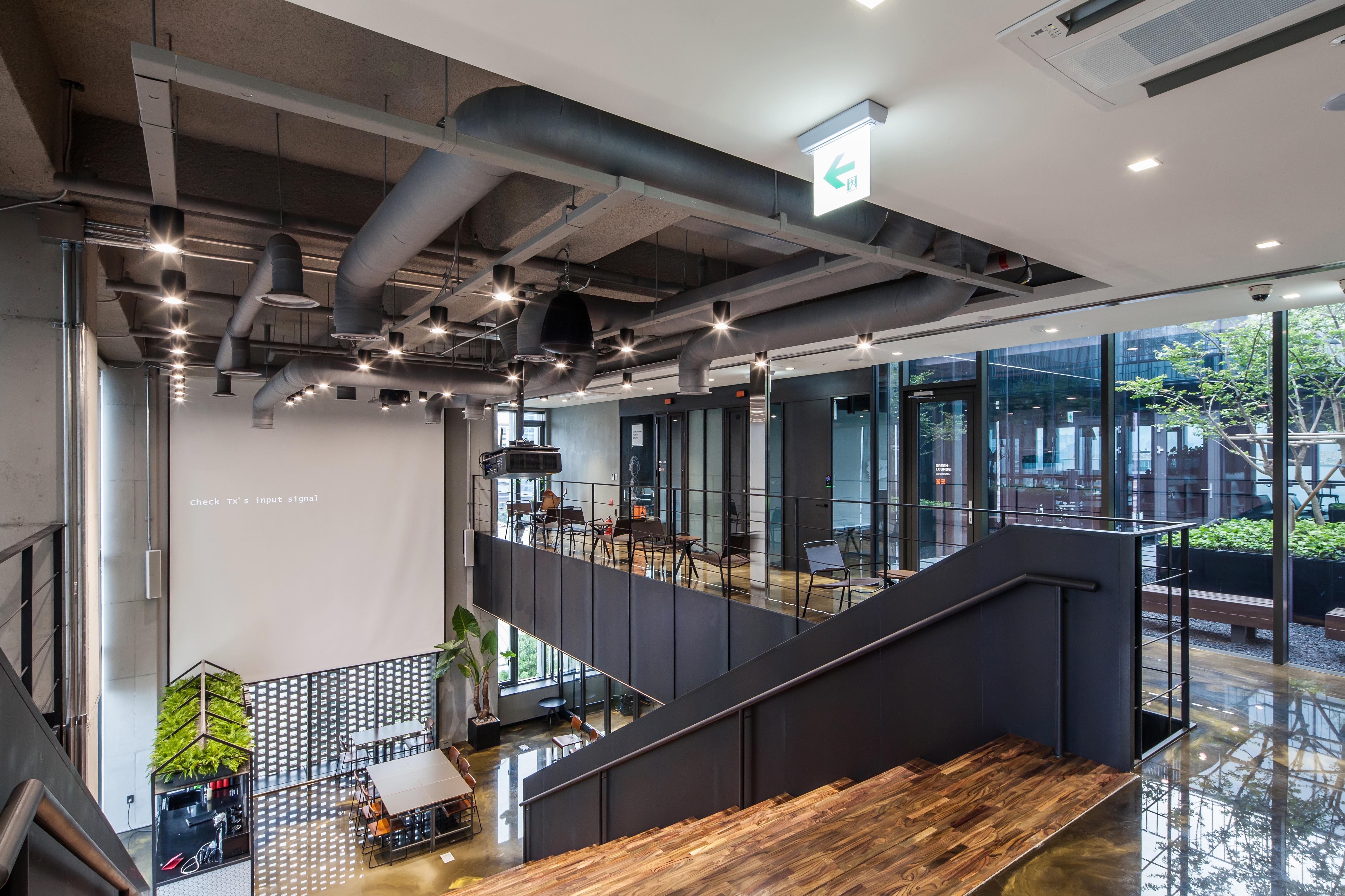 The areas between one floor and another at co-working space HeyGround are designed to foster interaction between users of the space. (Photo: Root Impact)